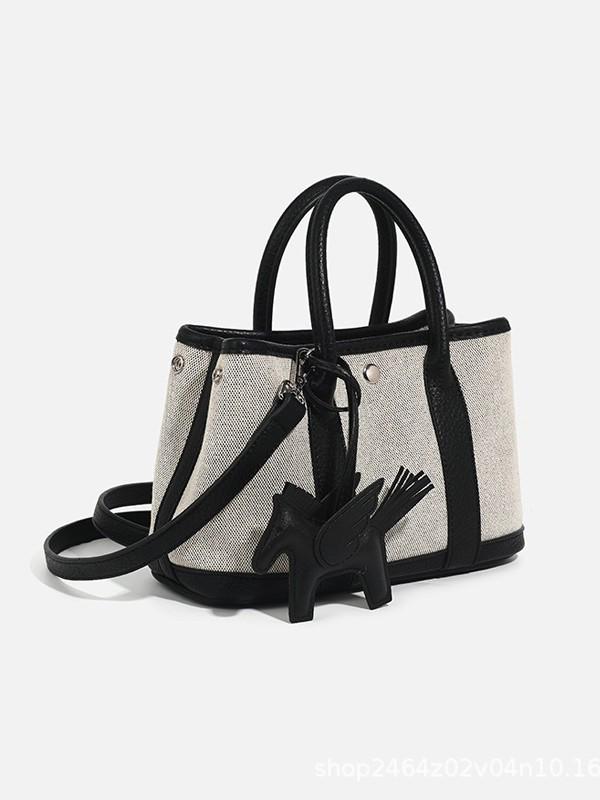 Niche Luxury Canvas Mini Garden Handbag: Stylish, Versatile Crossbody for Women