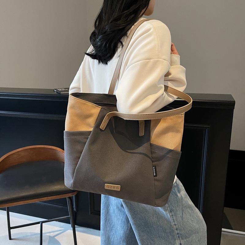 2025 neue Umhänge-Messenger-Canvas-Tragetasche mit großem Fassungsvermögen, tragbarer Modetrend, vielseitig, lässig, farblich passend, Damentasche