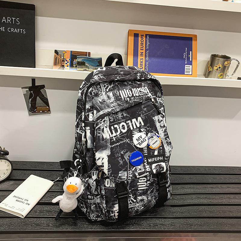 Backpack women's new fashion Japanese personality graffiti junior high school student schoolbag male college student lightweight travel backpack tide