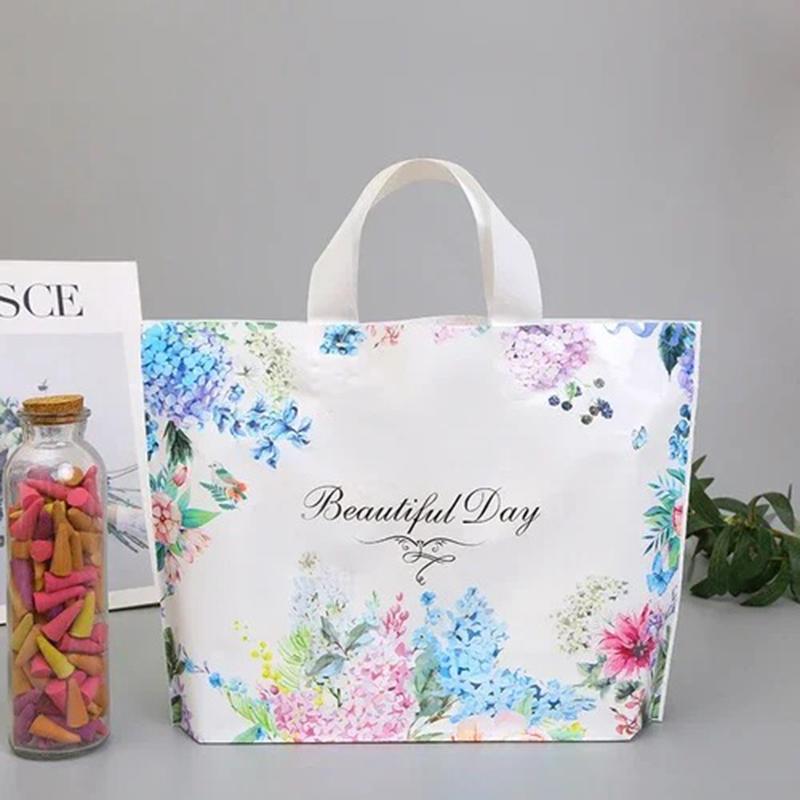 

50 шт. Высококачественная толстая сумка, магазин одежды, магазин подарков, пластиковые упаковочные сумки с принтом, модная прочная портативная сумка для покупок 30X25X6cm