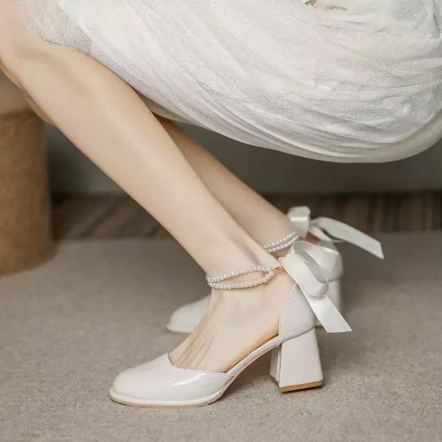 2025 summer new versatile round head thick heel bag head pearl bow light mouth hollow sweet Mary Jane shoes women
