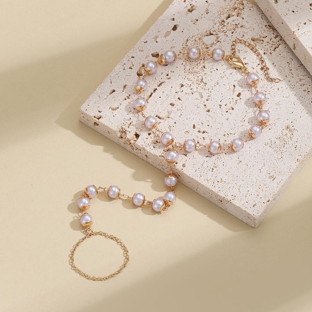 

Kinitial Exquisite and fashionable laser plated bracelet with a simulated freshwater pearl as an anniversary commemorative gift