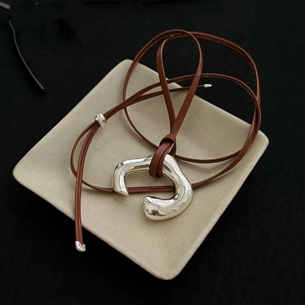 New Korean Brown Leather Cord Necklace with Abstract Human Body Silver Pendant - Light Luxury Clavicle Chain