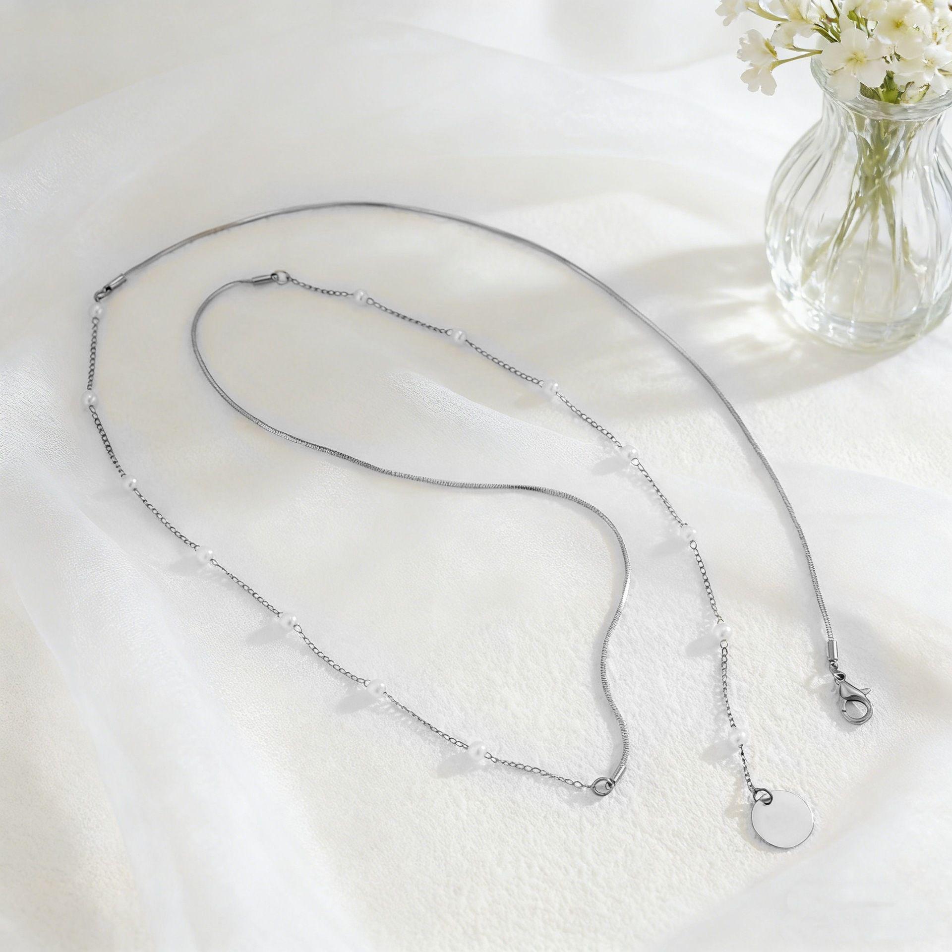 

Elegant Double-Layer Snake Bone Chain Necklace with Faux Pearl Tassel