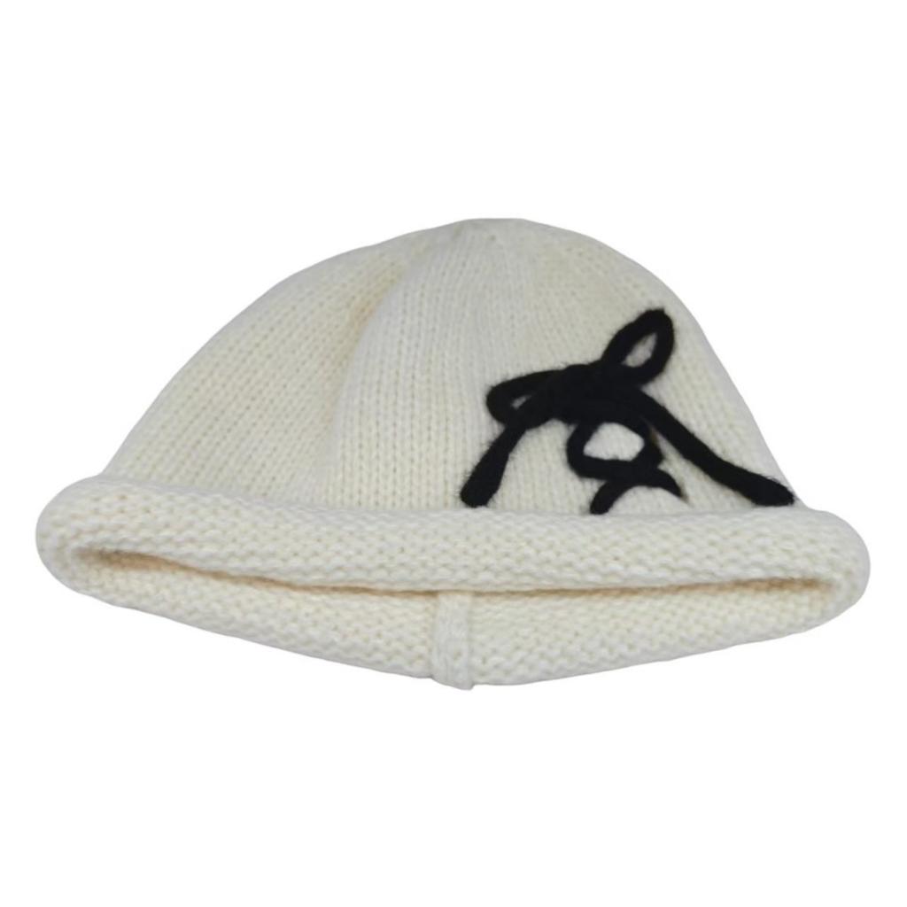 Literary bow decorative sleeve knitted hat thick needle crimped women's cold hat autumn and winter thickened wool hat