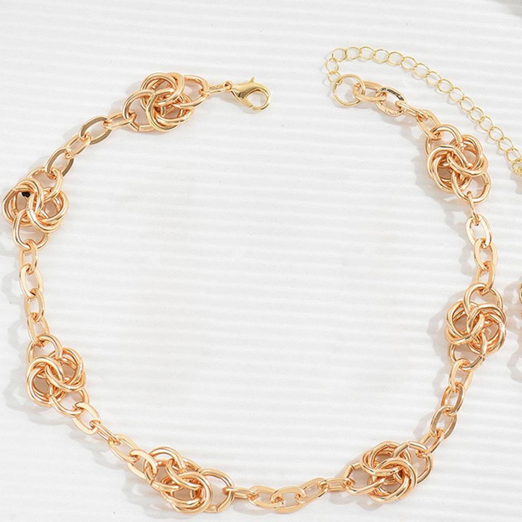 Exquisite Gold Metal Choker Necklace: Elegant Neck Jewelry Set with Matching Bracelet and Earrings.