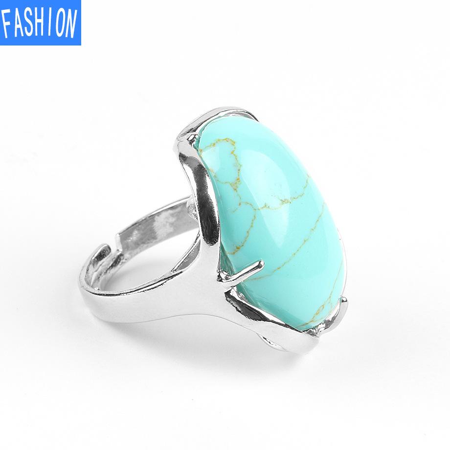 Natürlicher ovaler Kristallring mit vier Krallen