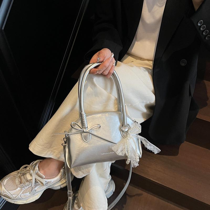 New Sweet Bow Commuter Shell Bag Women's 2025 Korean Version Simple Popular Shoulder Bag Foreign Style Armpit Bag
