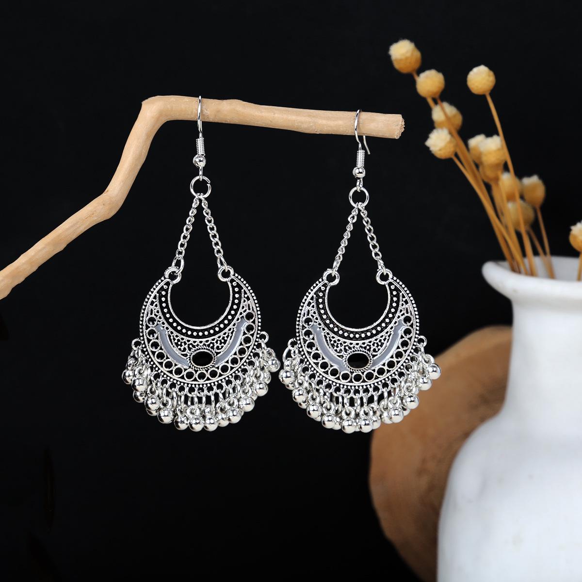 

Барвисті етнічні довгі сережки з пір яними китицями