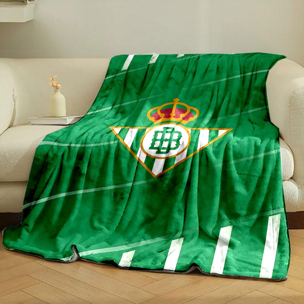Diagonal green stripes with white accents and a central triangular logo. for all seasons blanket lunch break throw gift