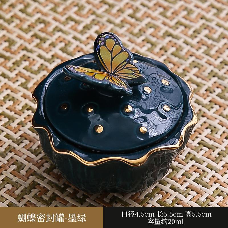 

Ceramic sealed jar Tea packaging jar Fragrance powder box Carmine face cream and cream in separate bottles Butterfly lid