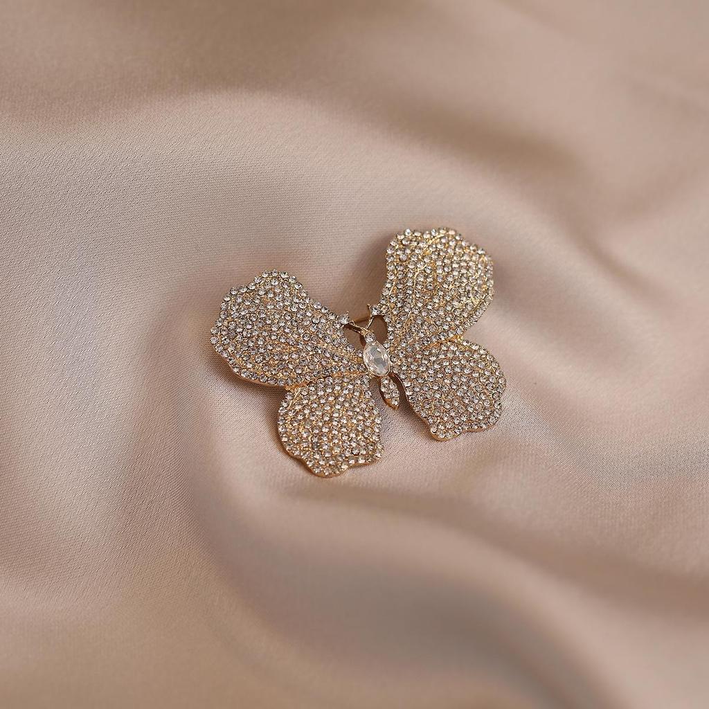 Elegante Schmetterlingsbrosche mit Perle – Damen-Modeschmuck-Anstecknadel von hoher Qualität