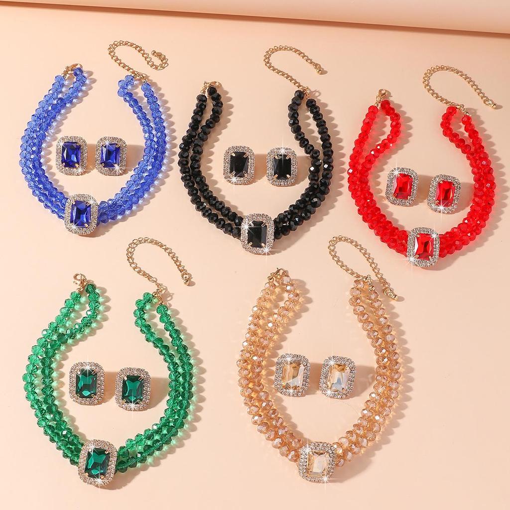 Luxuriöse doppellagige geometrische Kristallkette und rechteckiges Ohrstecker-Set