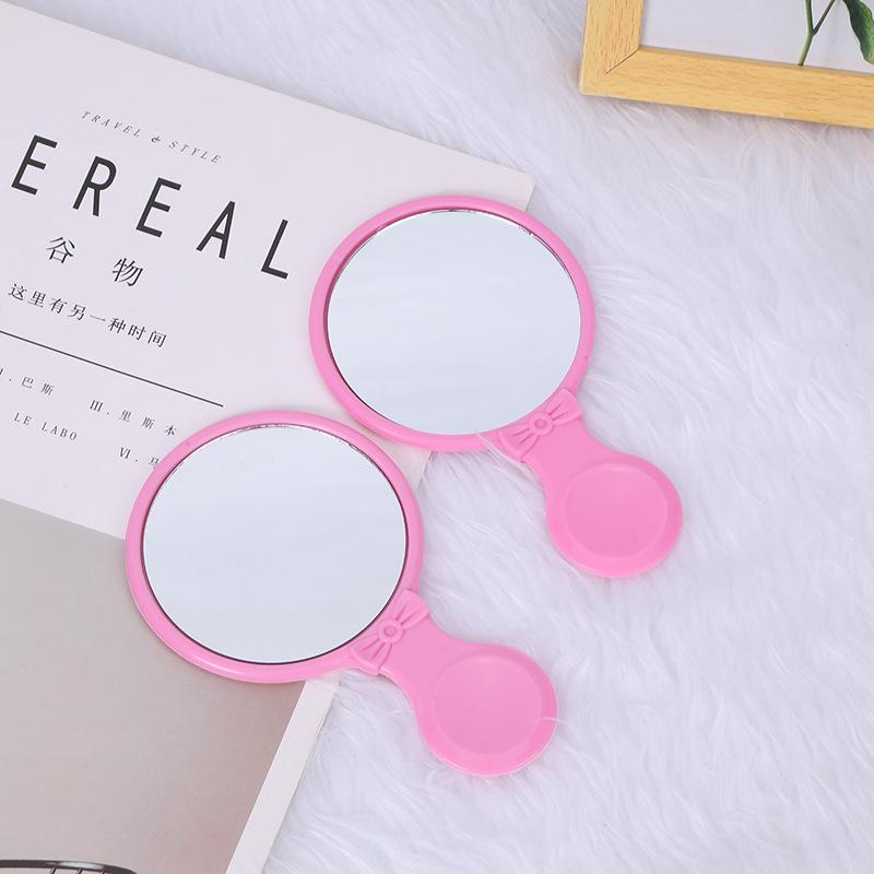 Kompaktes Handspiegel- und Kammset - Tragbar und taschenfreundlich für die Haarpflege