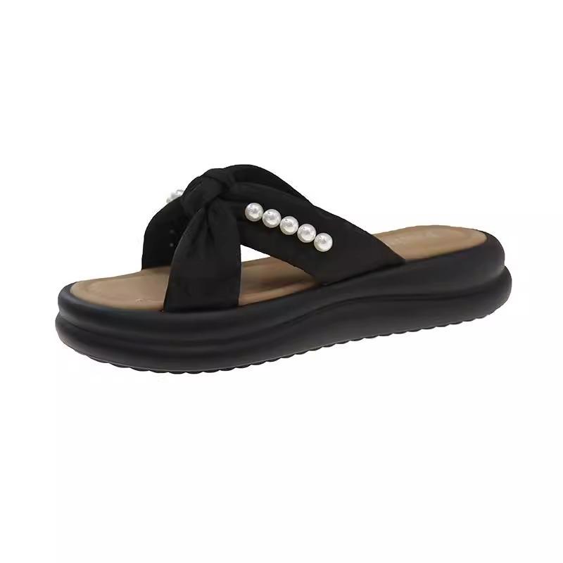 2025 new thick bottom stepping on shit feeling one-word sandals women summer wear Internet celebrity casual retro pearl national style slippers