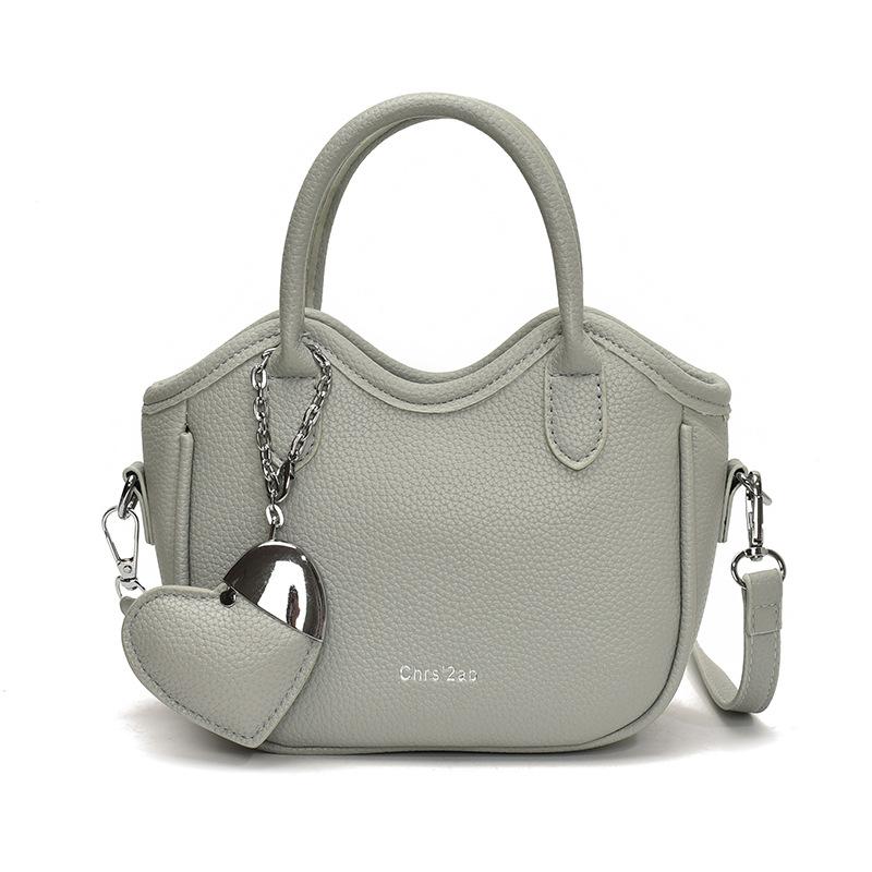 

Горячая распродажа весной и летом корейская нишевая высококлассная простая портативная сумка-ведро женская в иностранном стиле для通勤, универсальная текстурная сумка-мессенджер синий