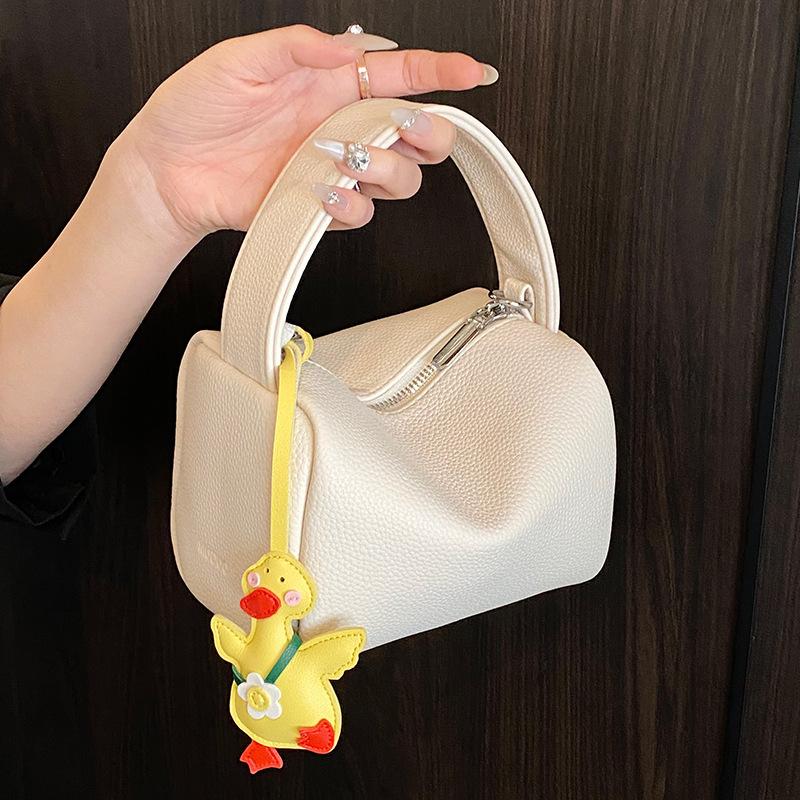 This year, dopamine is popular, simple lychee pattern portable pillow bag, casual versatile commuter fashion messenger women's bag.