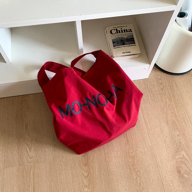 Lazy wind casual large-capacity underarm bag women's 2025 new letter-printed canvas bag shoulder bag