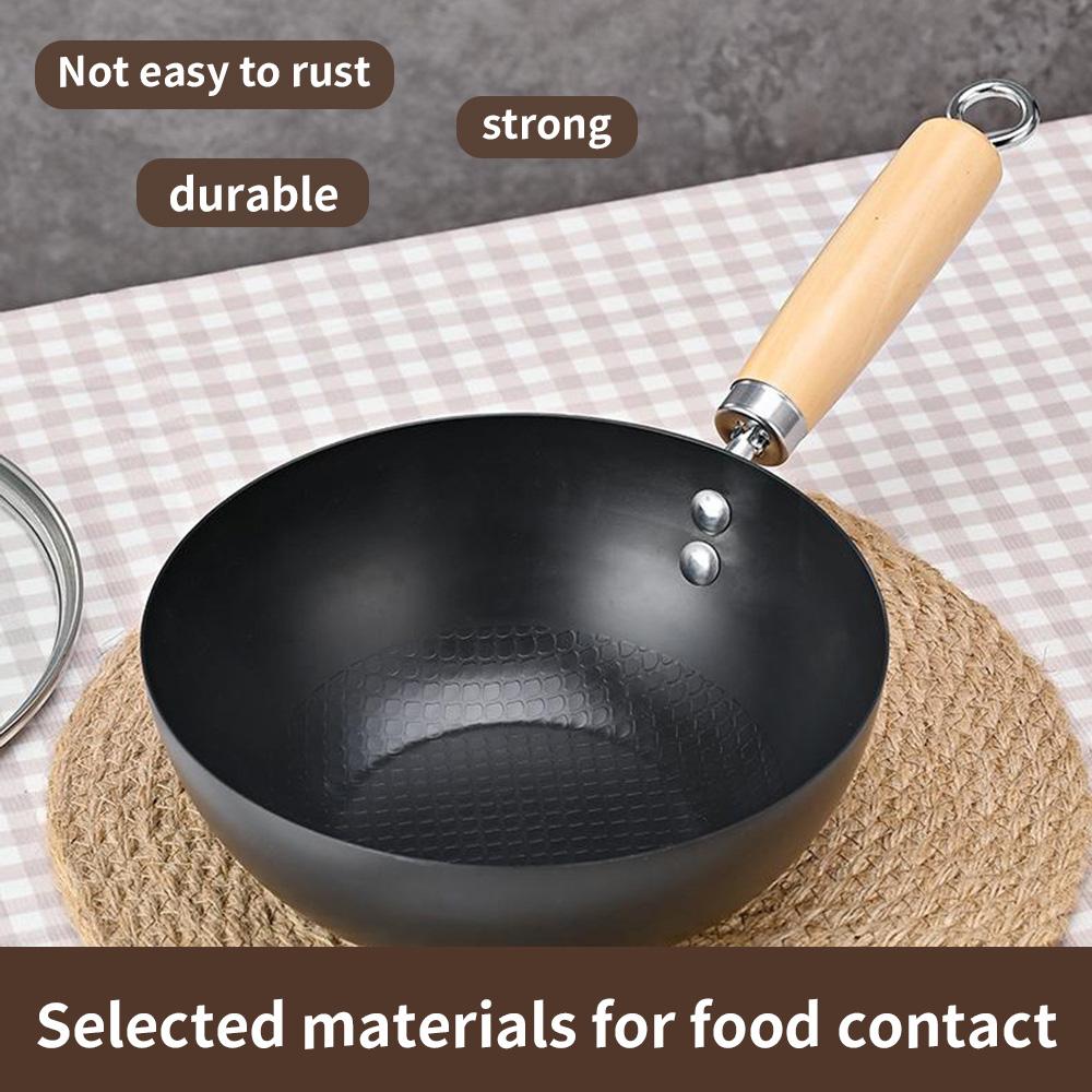 A deep circular, stir fry iron pan, uncoated and non stick pan, compatible with induction cookers