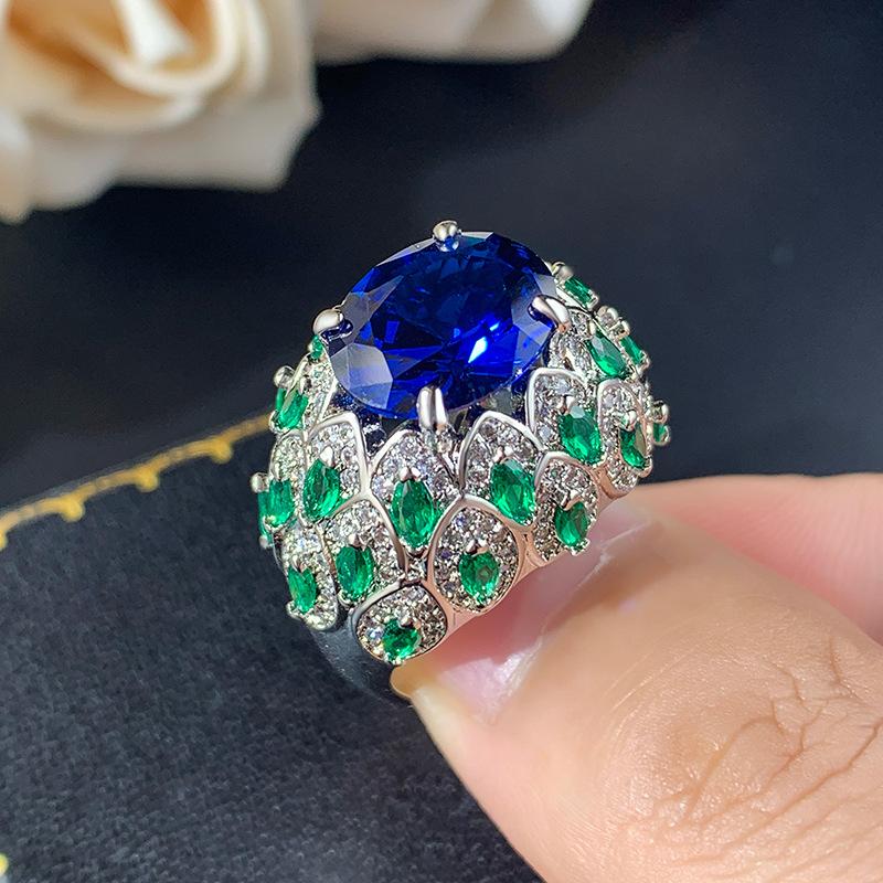 

Ювелирные изделия Модное кольцо Женское Имитация красного корунда Изумруд Синяя шпинель Полный бриллиант Высококачественное женское
