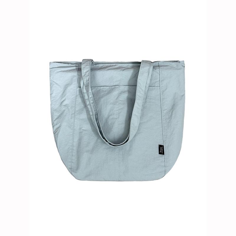 Korean simple solid color canvas bag women's 2025 new large-capacity lightweight shoulder tote bag versatile commuter bag