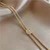 A Single Elegant Golden Copper Compass Star Pendant Necklace with Sparkle - a Long Sweater Chain Perfect for Autumn and Winter