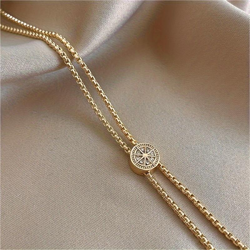 A Single Elegant Golden Copper Compass Star Pendant Necklace with Sparkle - a Long Sweater Chain Perfect for Autumn and Winter
