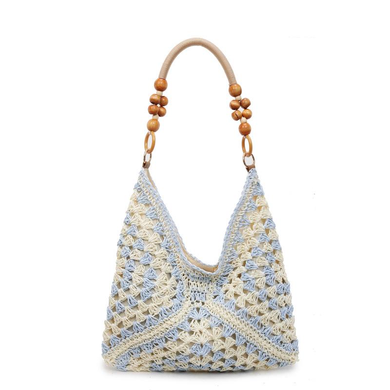Sommer beliebte gewebte Tasche Damen neue Mode hohl tragbare Umhängetasche Strandurlaub Tragetasche