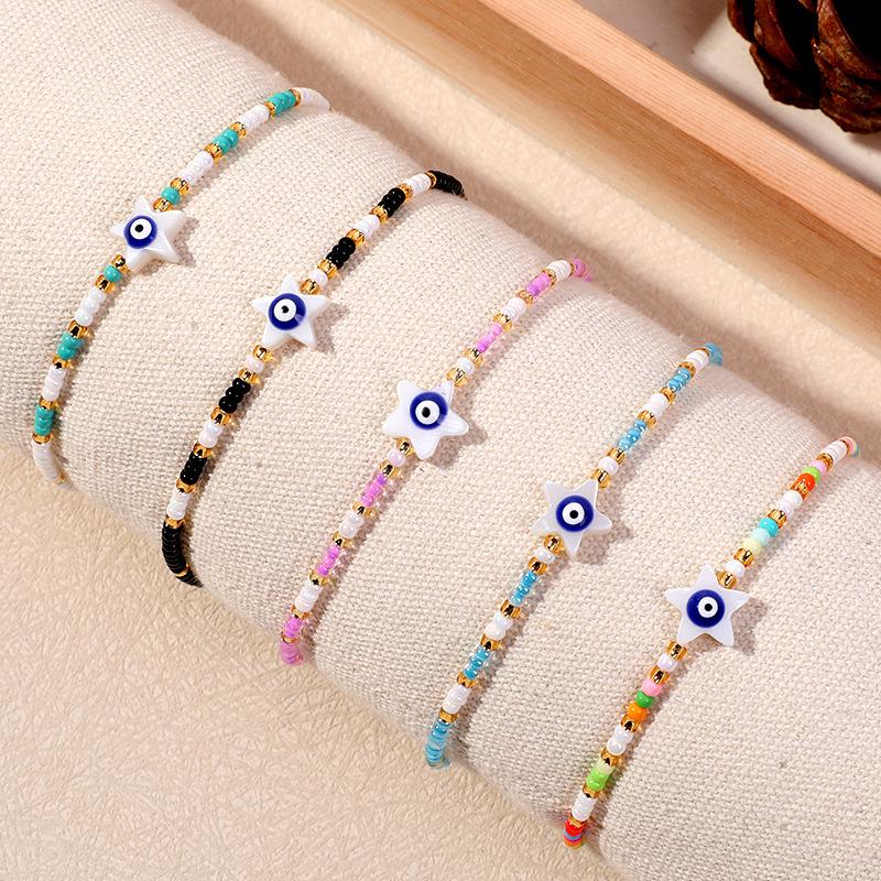 Bracelet en perles d'œil du diable tissé à la main avec motif de niche en verre