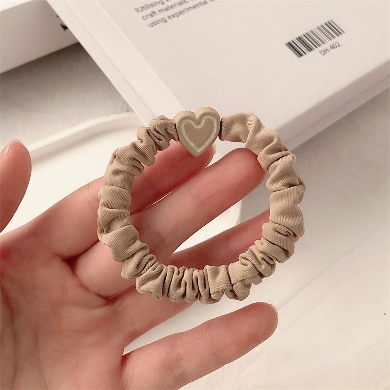 Nowy Pierścionek do Włosów w Kształcie Serca 2024: Wysokoelastyczna jesienno-zimowa gumka do włosów damska ze skórzaną osłonką.