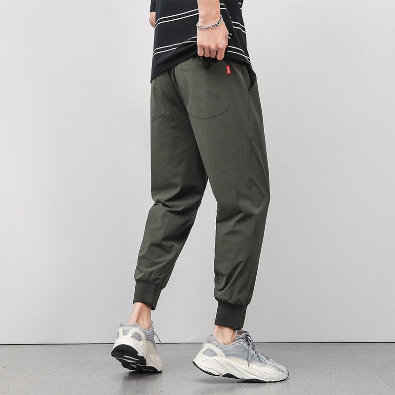 

Нейлоновые четырехсторонние пулевидные брюки средней и молодой возрастной группы из ледяного шелка, длиной девять очков, повседневные, для мужчин, свободные в ногах, летние тонкие быстросохнущие спортивные брюки 4XL