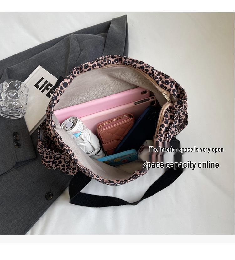 Leopard Print Canvas Tote: Large Capacity Autumn Shoulder Bag for Women, Versatile for College and Commute.