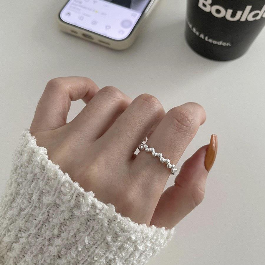 Irregular Hollow Flower Ring with Small Beads for Women – Adjustable, Stackable, and Versatile Design for Index Finger.