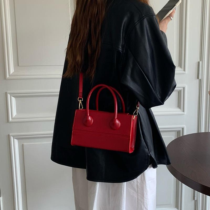 Neues Temperament tragbare kleine Tasche schlicht lässig rot Retro Textur Schulter Umhänge kleine quadratische Tasche Frau