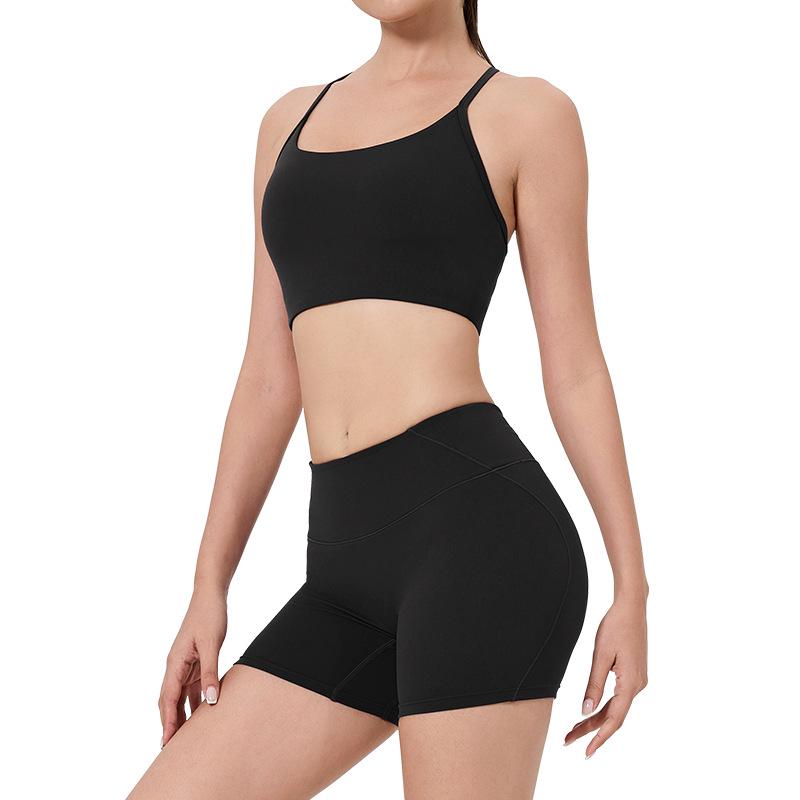 Women's High-Waist Fitness Set: Sports Bra with Pads, Beautiful Back Design, and Three-Point Peach Lift Shorts for Yoga and Pilates.
