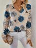 Women's Off-White V-Neck Knit Sweater with Blue Floral Pattern and Lace-Up Sleeve Detail
