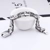 Men's Titanium Steel Bracelets with Personalized Retro Punk Style Patterns and Portrait Castings ,featuring Decorative Borders.