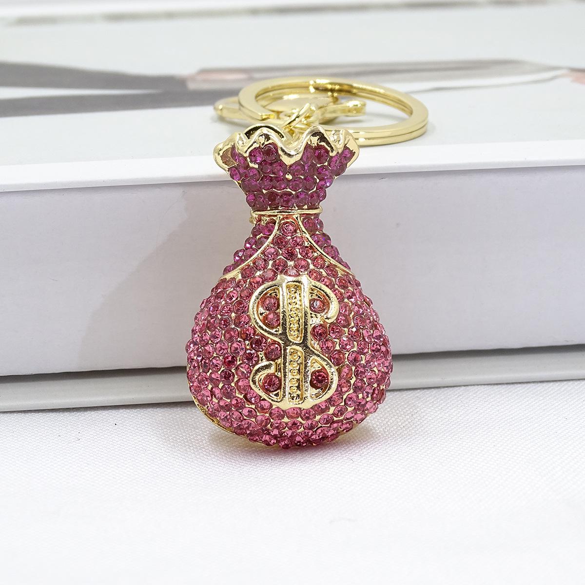 

Модний брелок зі сплаву: 3D Підвіска-мішок з грошима в подарунок глибокий рожевий колір