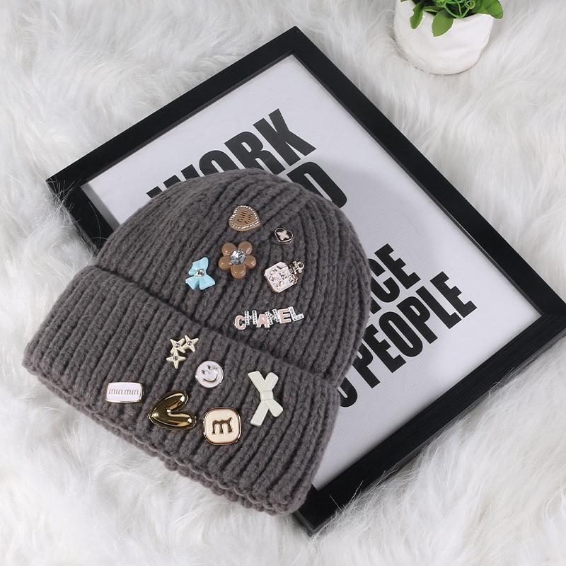 Korean version designer knitted hat children's sweet button face small wool hat autumn and winter bag head warm cold hat