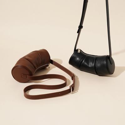 Damenledertasche Bambustasche Frühling und Sommer neu 2025 Nische schlichtes Design Rindsleder Zylinder Damen Achsel Umhängetasche