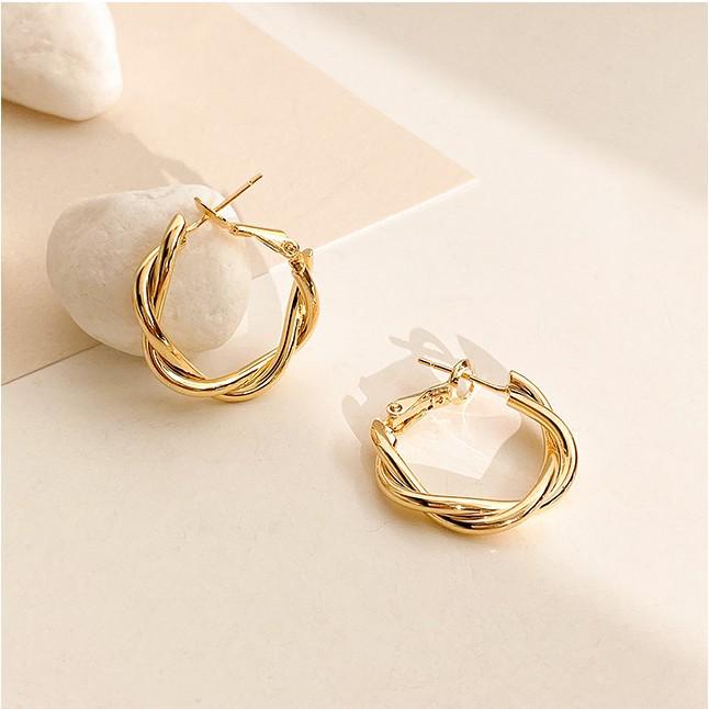 2024 Trendy Metal Geometric Twist Hoop Earrings: European and American Niche Design for Women