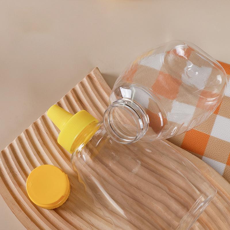 Transparent Reusable Plastic Honey Bottles Squeeze Honey Bottle Container Holder With Lid For Storing And Dispensing Honey Jar