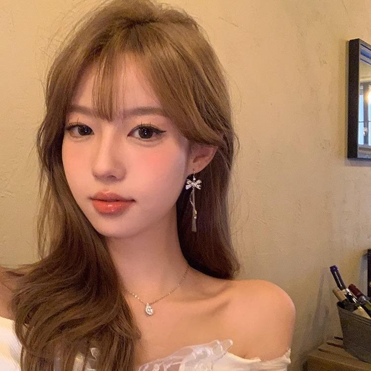 

Heartbeat Tassel Earrings: Slim Face, High-End, Light Luxury for Women 581B [Clip-on]