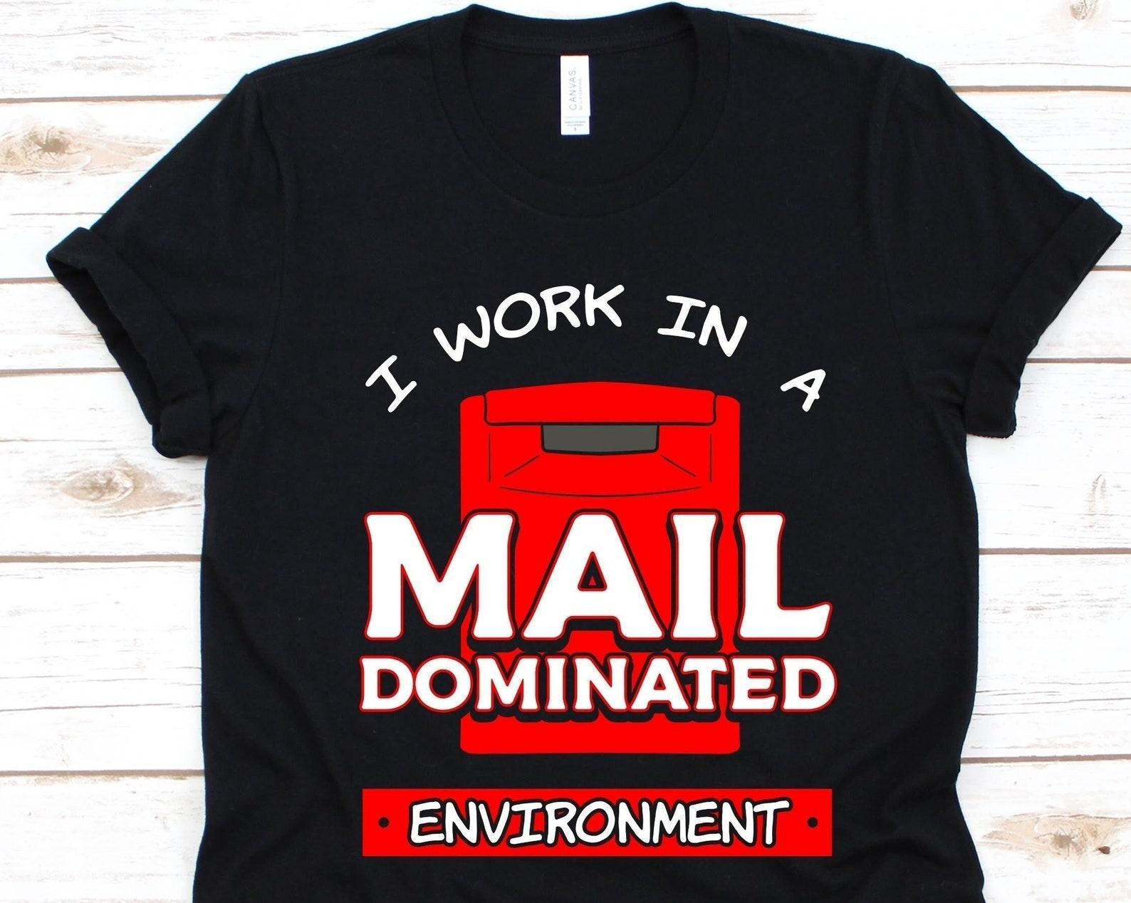 I Work In A Mail Dominated Environment Shirt, Postal Worker Gift For Mailman Or Mailwoman, Postman, Postal Carrier, Funny Rural Carrier L