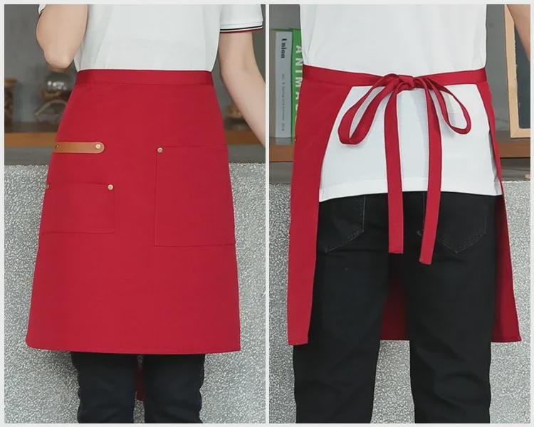 Unisex vanntett kjøkkenforkle i kanvas med halvlangt design og logo i midjen