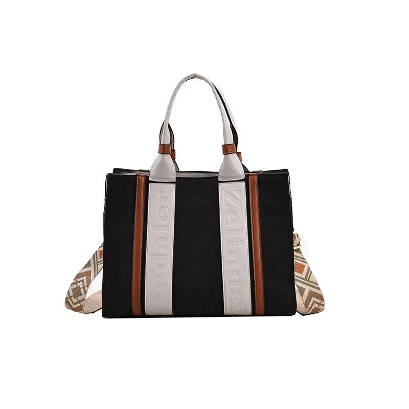 

Canvas bag women s large-capacity new spring and summer simple broadband messenger bag portable commuter tote bag