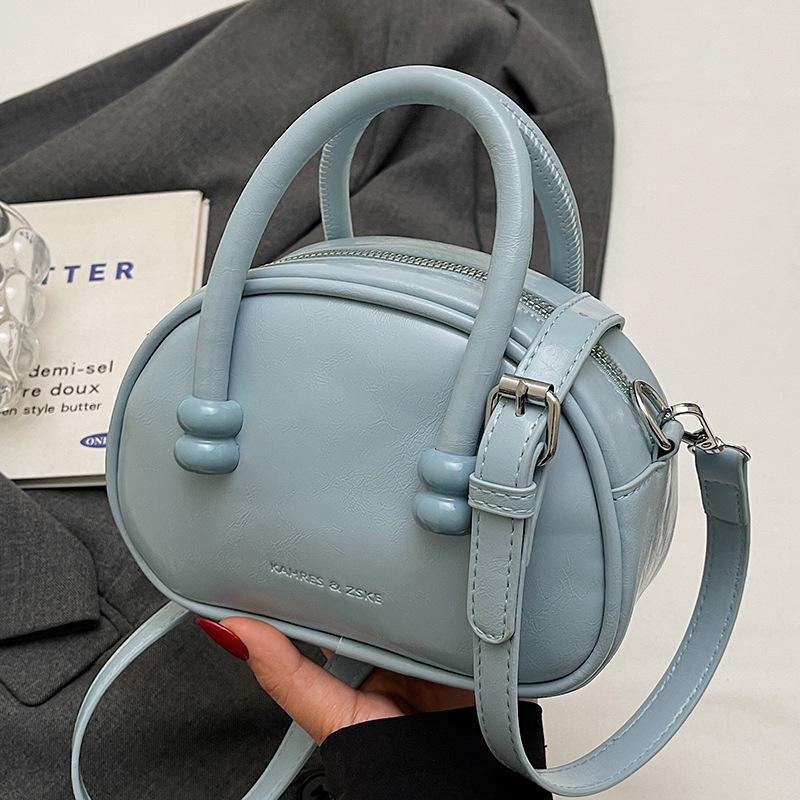 

Korean version of the hot-selling cream style portable bowling bag, girls fashion and advanced sense, foreign style versatile simple messenger bag