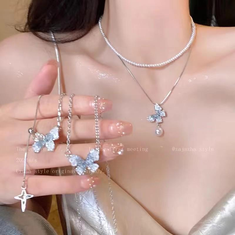 Pearl Butterfly Tassel Necklace: Ice Crystal Gradient Color, High-Grade Clavicle Chain for a Sweet, Cool Summer Style.