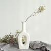 White Ceramic Vase with Dried Baby's Breath for Living Room or Dining Table Decoration