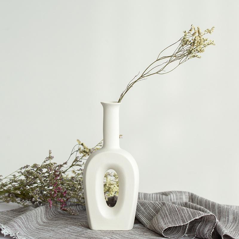 White Ceramic Vase with Dried Baby's Breath for Living Room or Dining Table Decoration